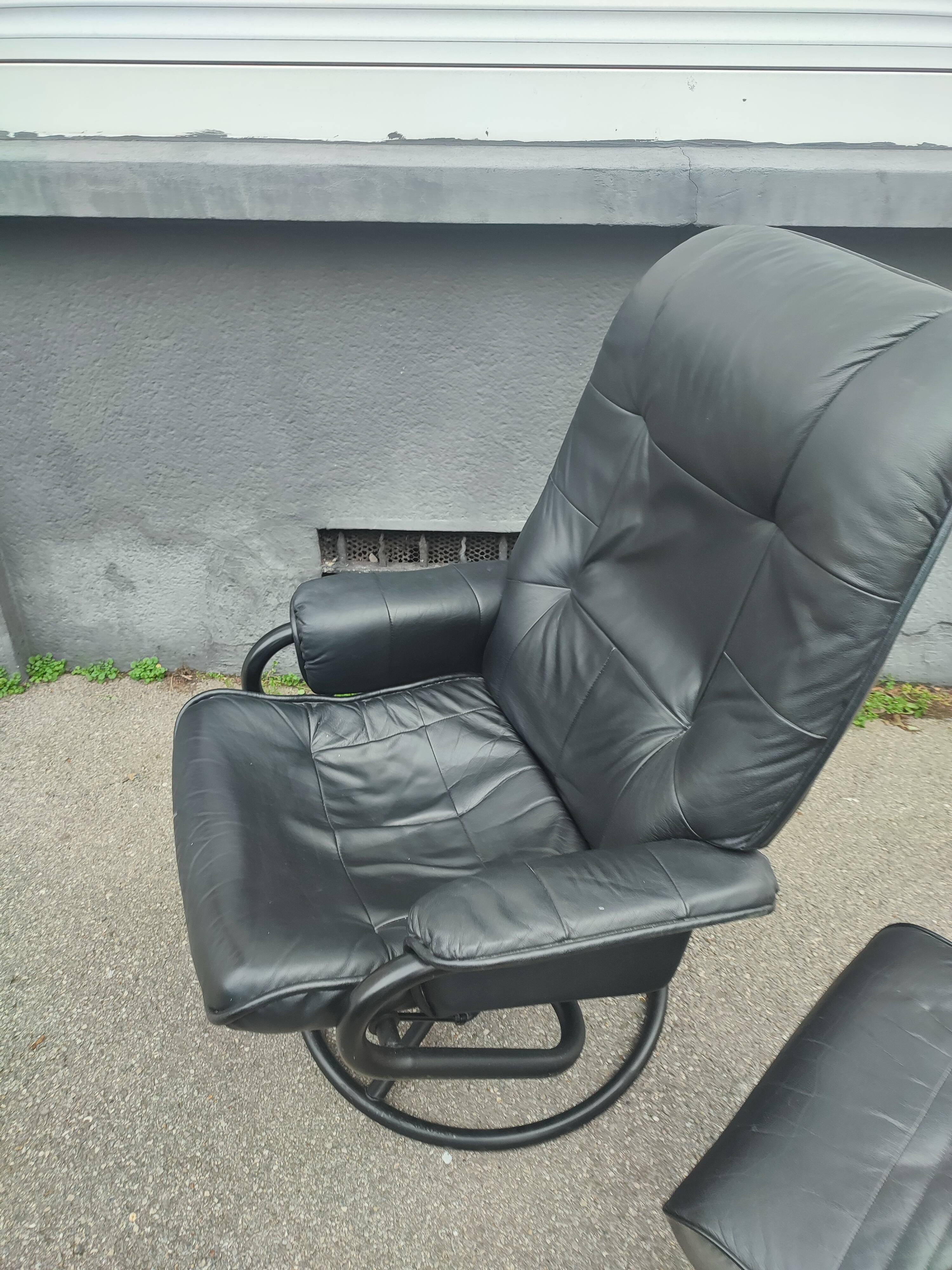 Scandinavian design leather armchair and footrest