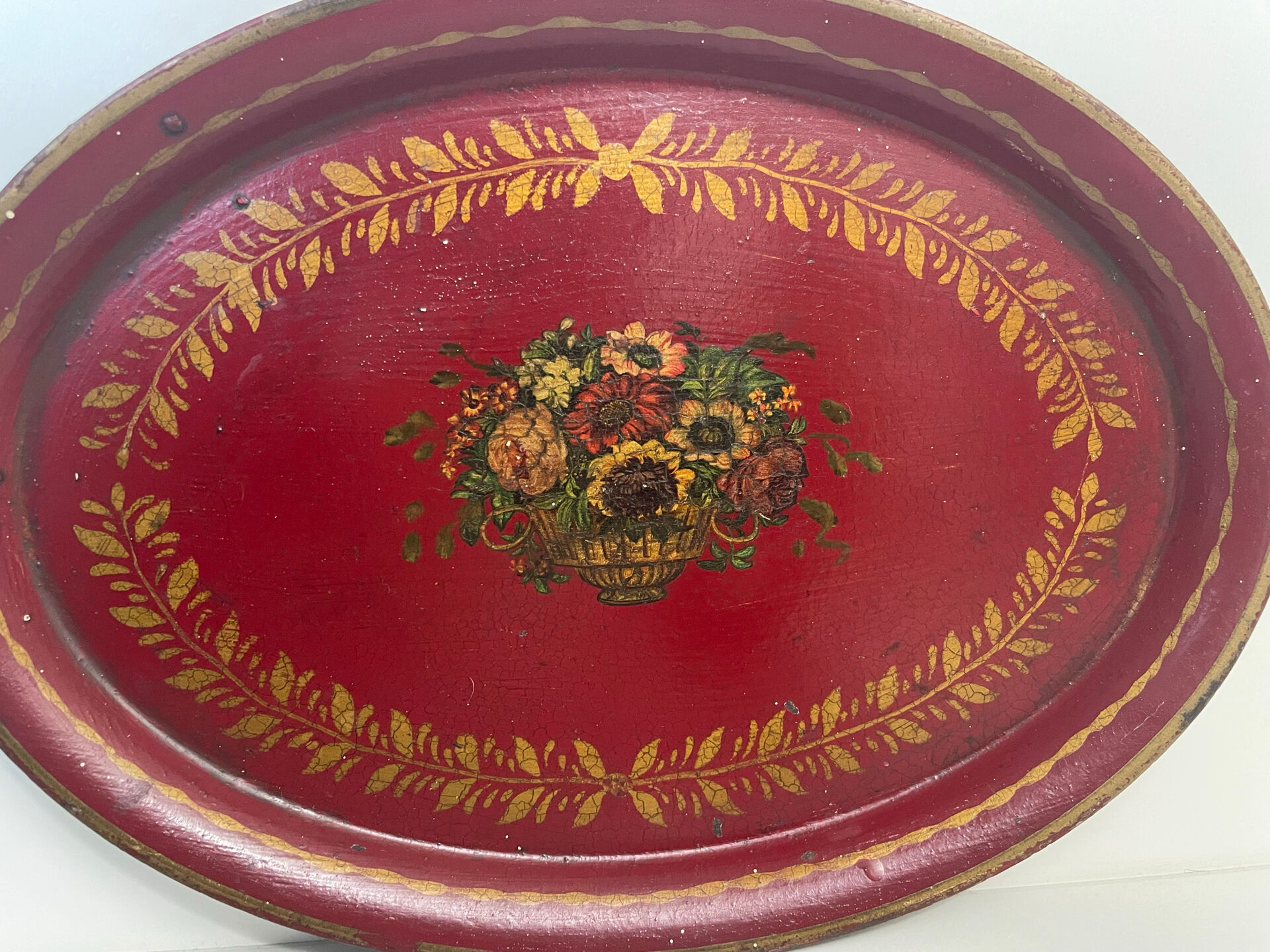 Old oval plate in painted red tin - floral decoration - early 20th century -
