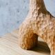 Hand-carved soliflore vase in solid chestnut wood.