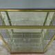 Brass display cabinet with a mirrored back – early 20th century