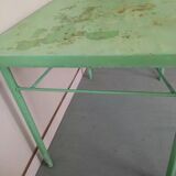 Green garden table in patinated metal