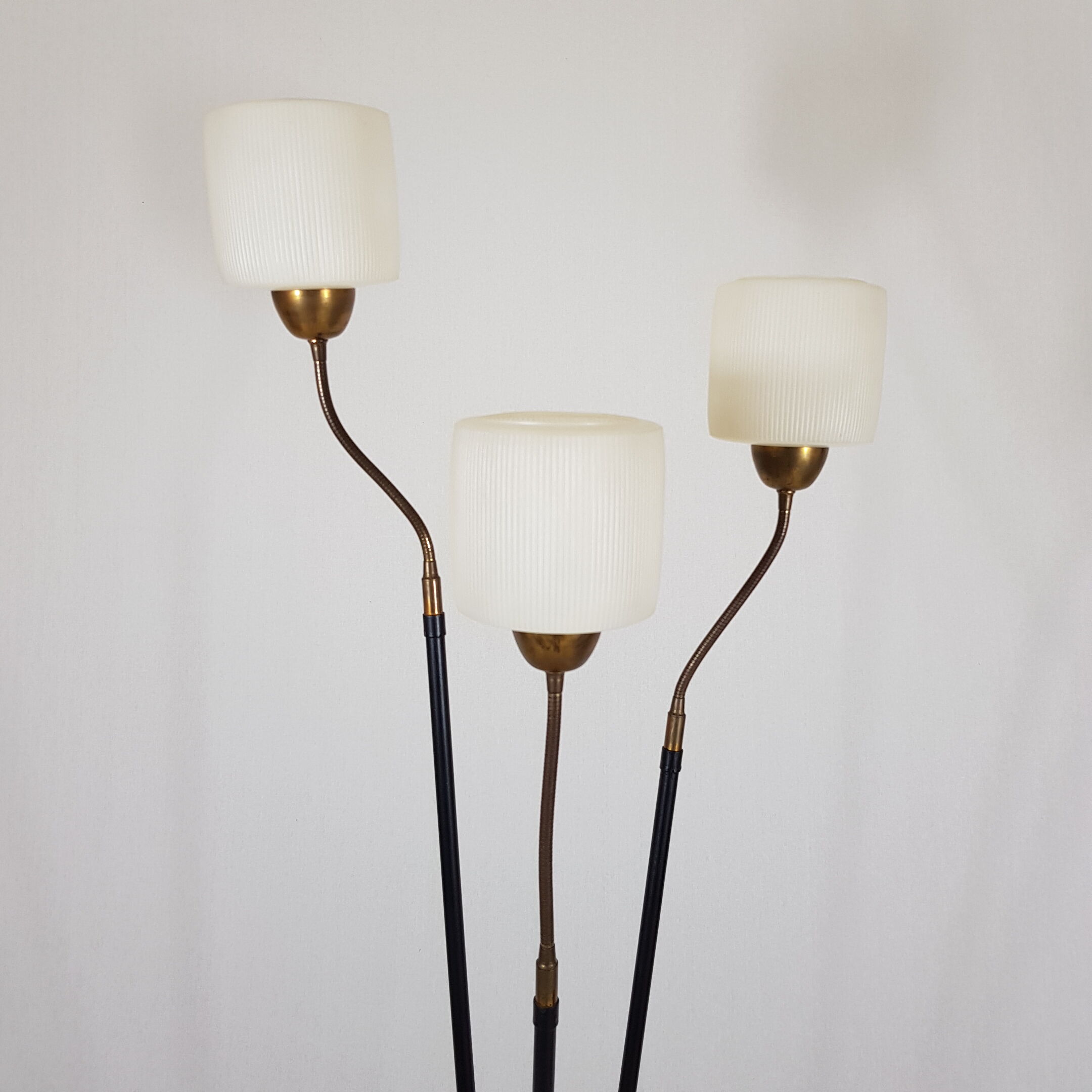 Golden brass tripod lamppost