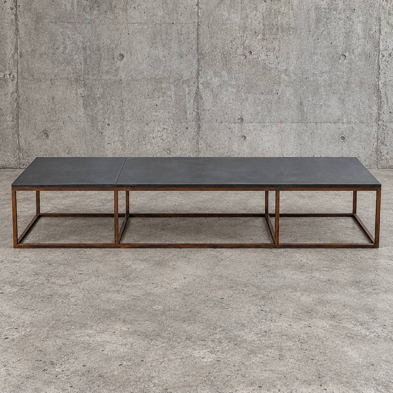 Weighty coffee table with solid iron frame and stone slate table tops, made on commission by architect Alex Vervoordt, Belgium 1990s