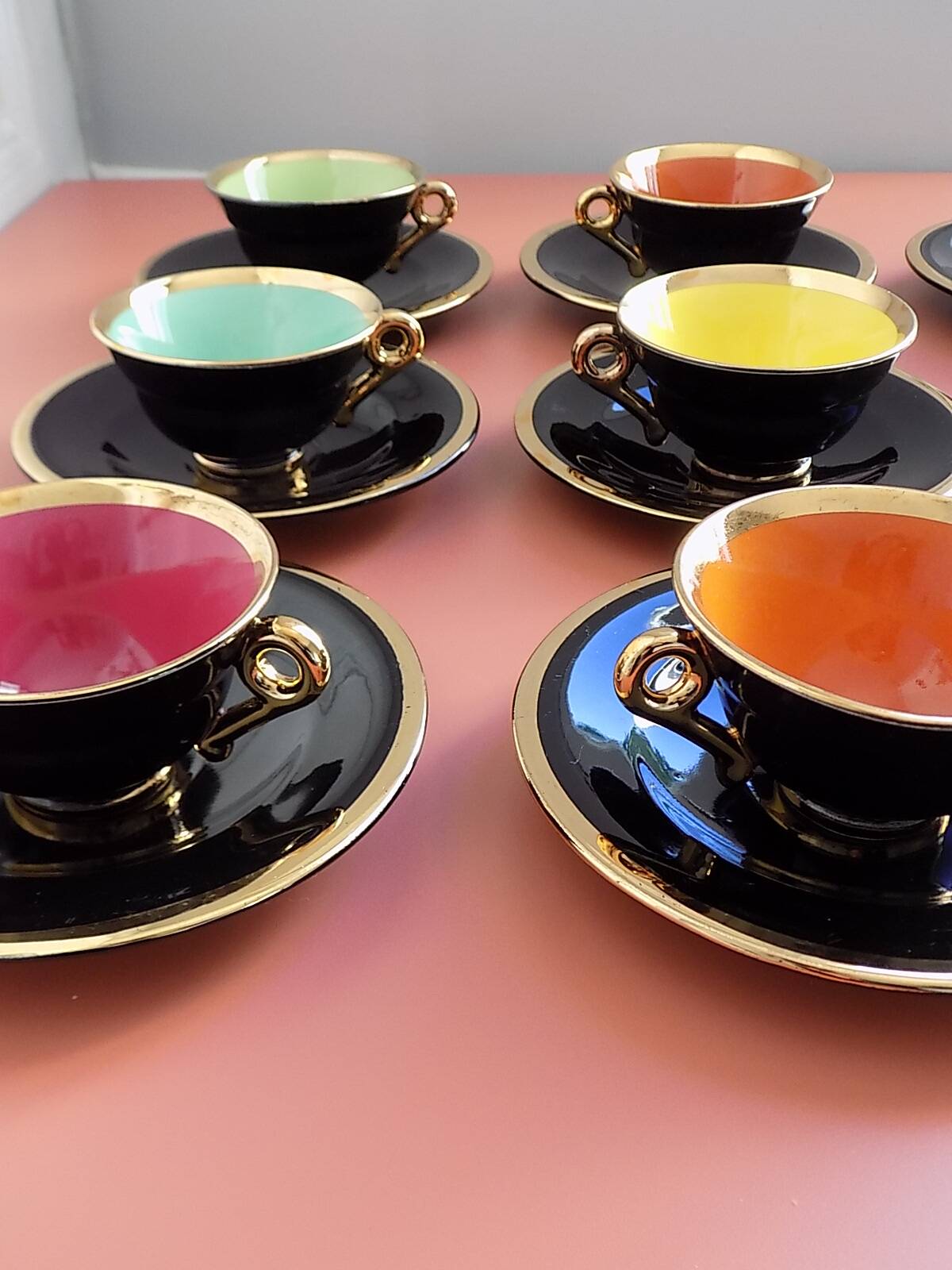 set of 9 black and gold Salins cups and saucers