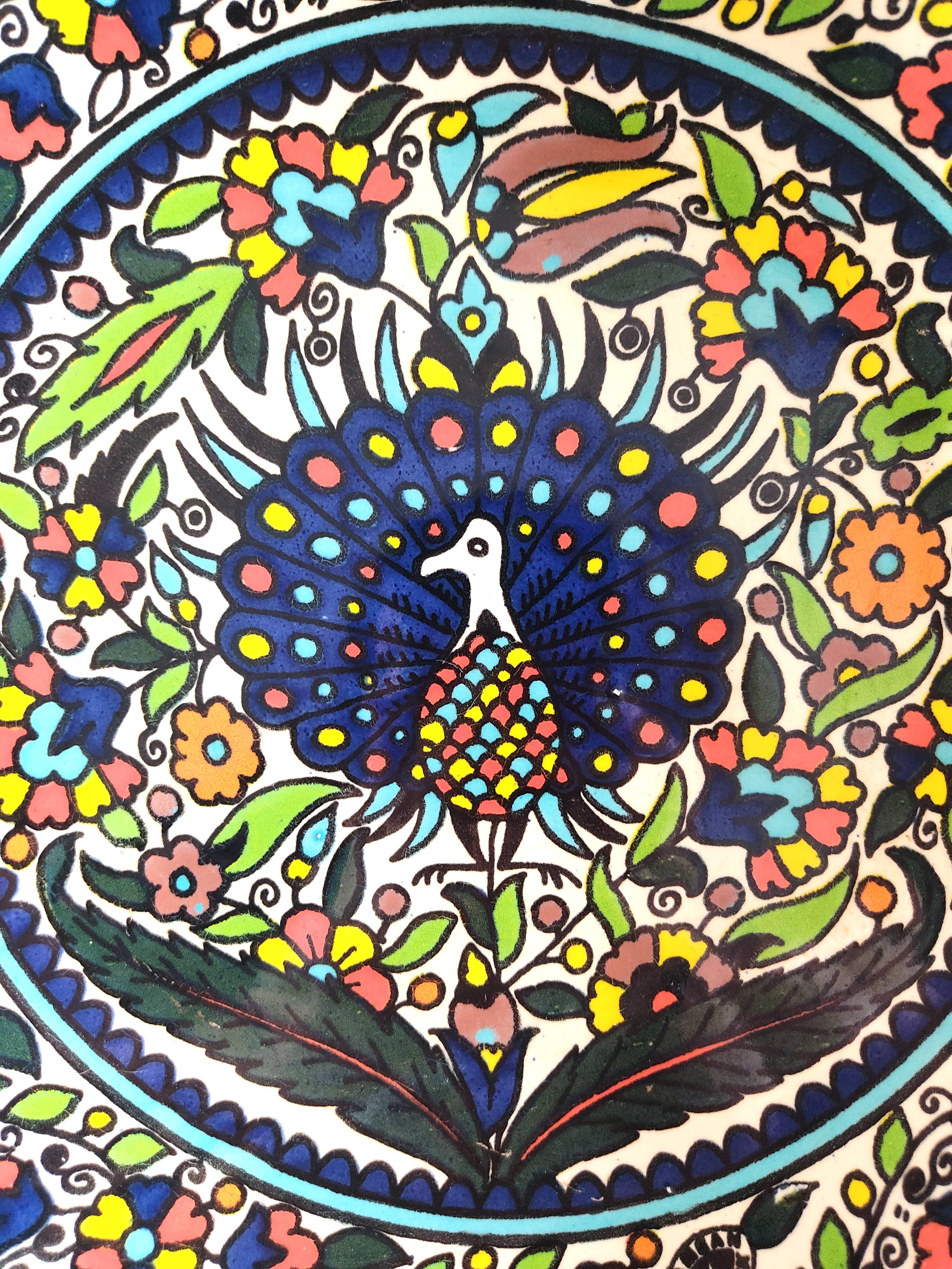 Large decorative dish with colorful peacock