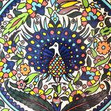 Large decorative dish with colorful peacock