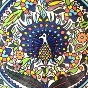Large decorative dish with colorful peacock