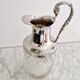 Glass and silver-plated carafe