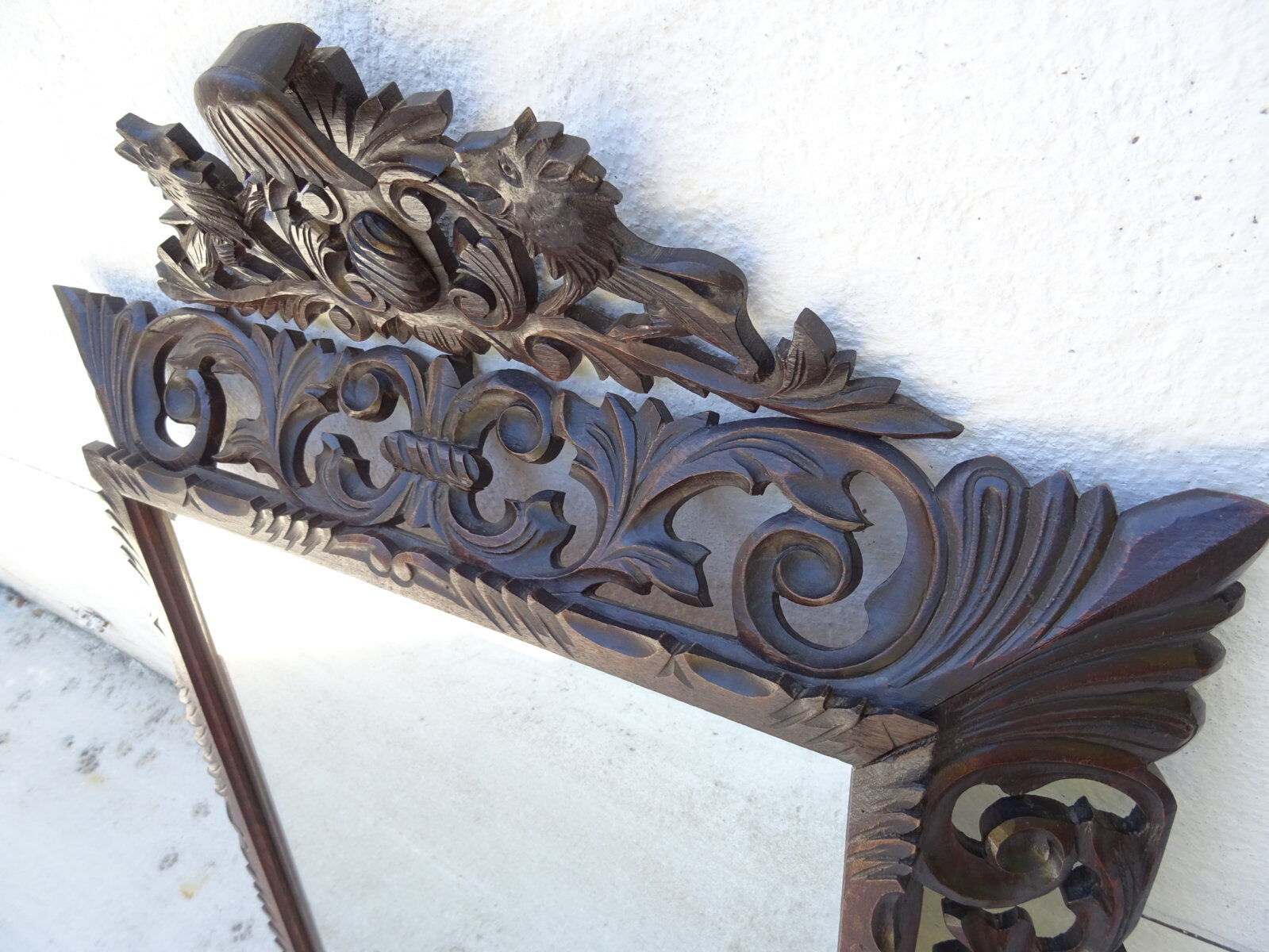 Miroir sculpté fronton lions