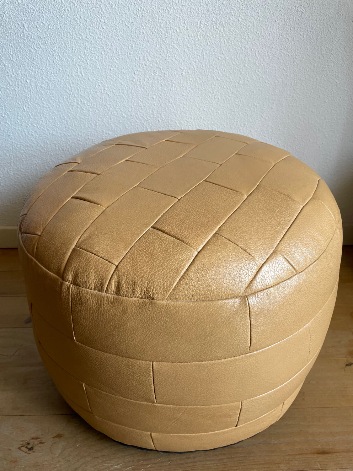 Beige patchwork leather pouf from Sède