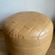 Beige patchwork leather pouf from Sède