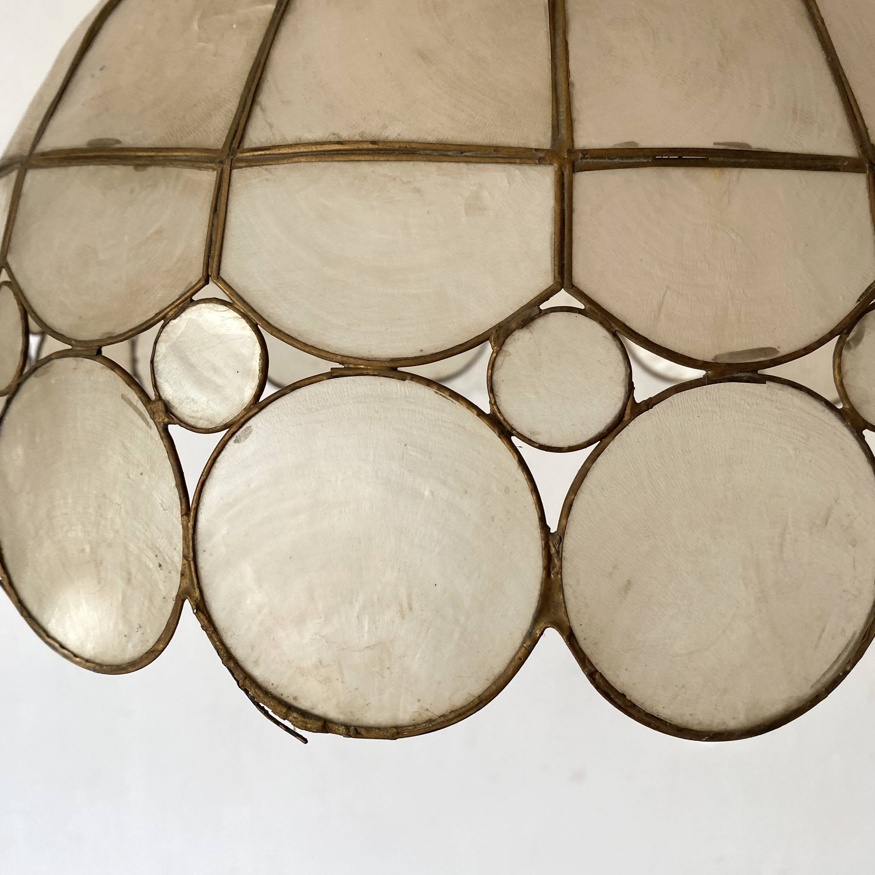 Pair of mother-of-pearl and brass pendants