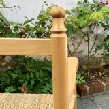 Old wooden and straw high chair for children