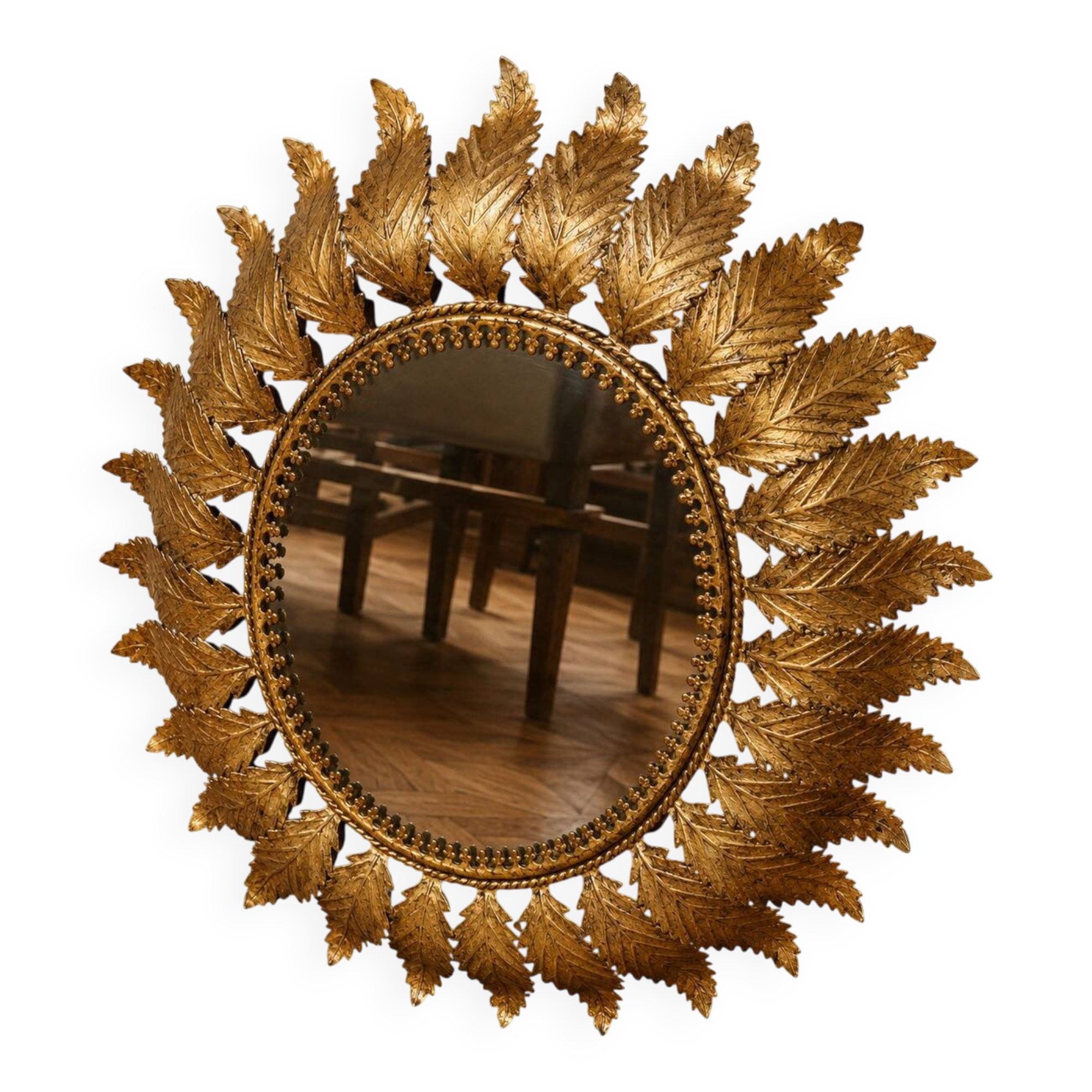 Golden metal sun mirror with leaf decoration