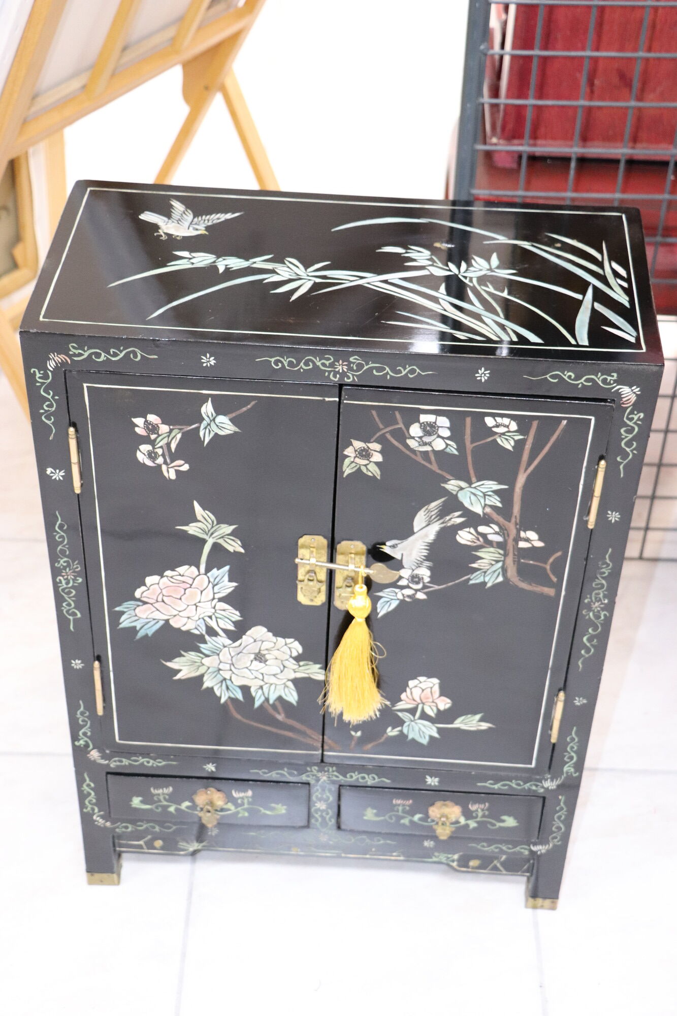 Small storage cabinet or bedside table lacquered black incised and painted