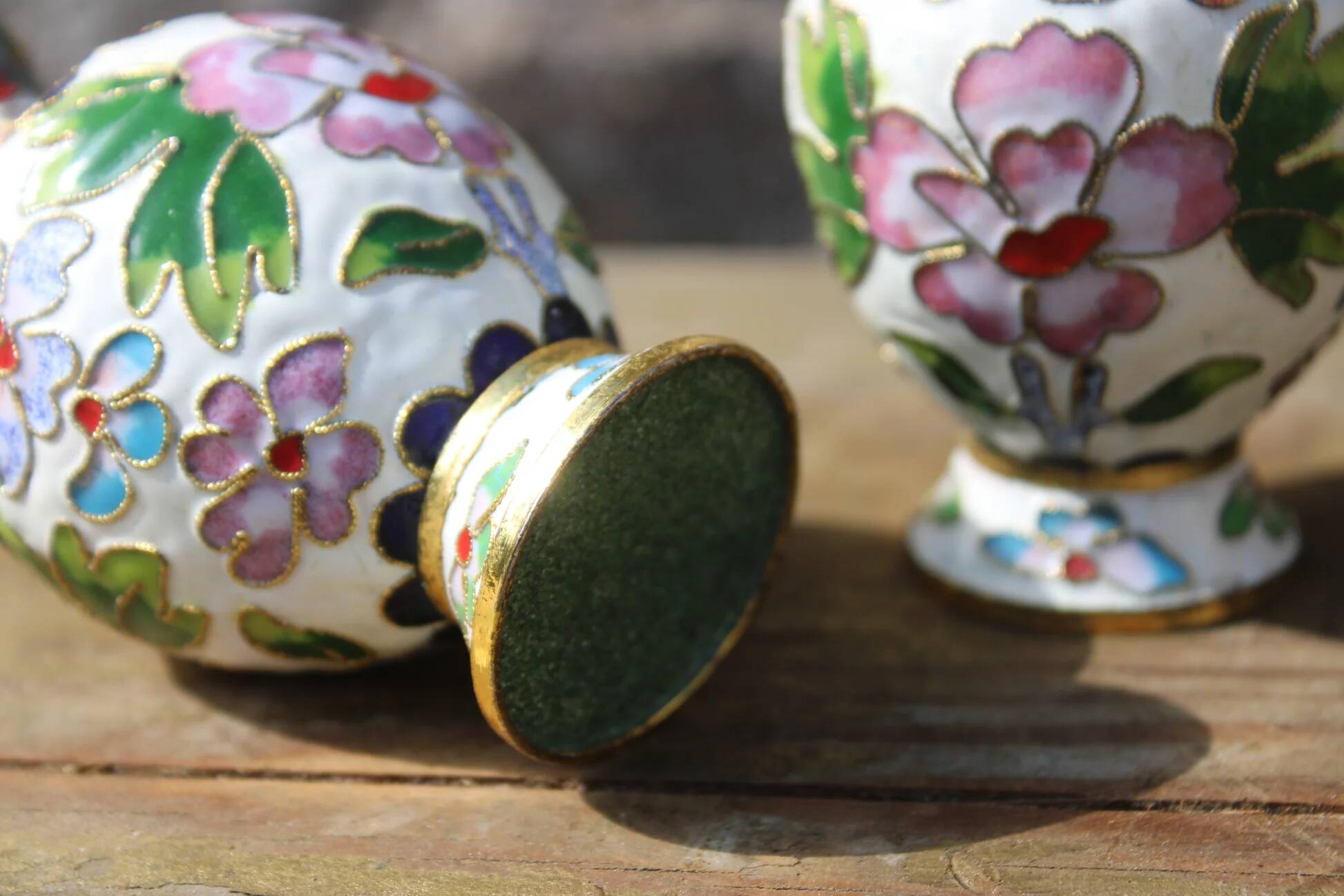 Two small vintage cloisonné enamel vases with Asian floral decoration.