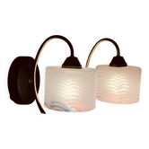 Pair of wall sconces with a swan neck in brass and a white glass shade.