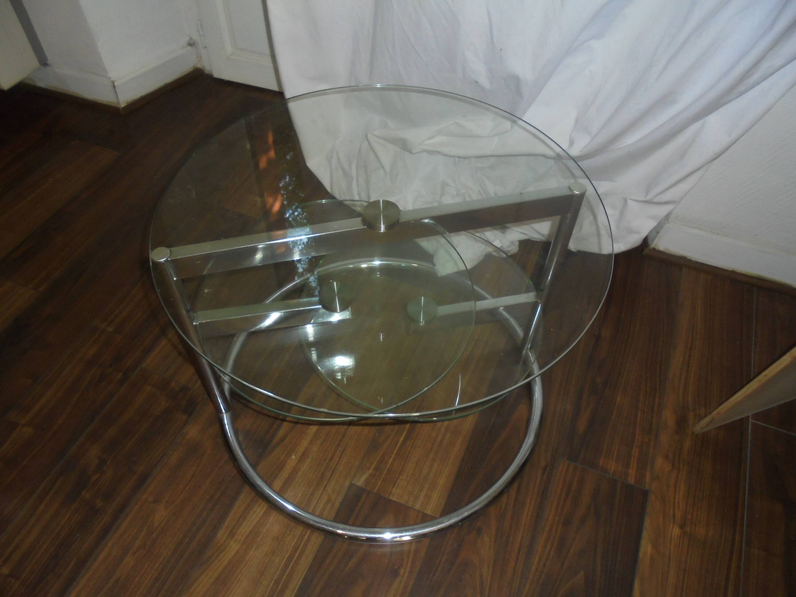 Glass coffee table with swivel tops circa 1980