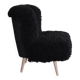 Mid-century black cocktail chair in lambskin, beech legs — 1960s