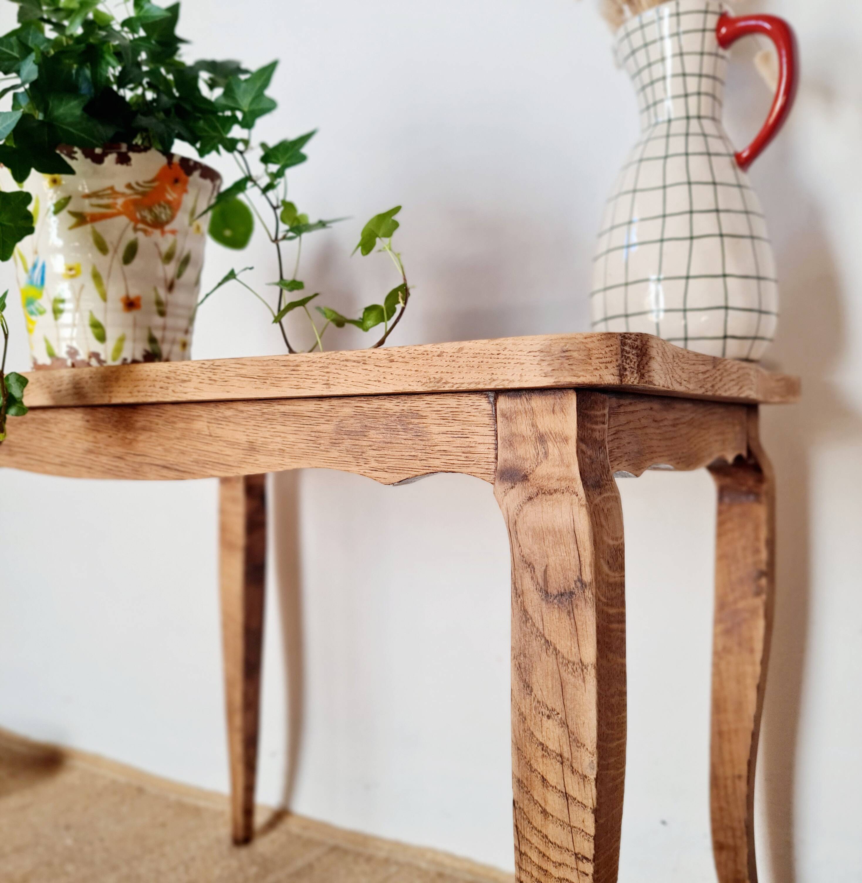 Antique coffee table with curved legs.