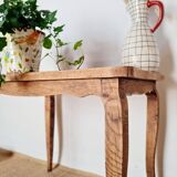 Antique coffee table with curved legs.