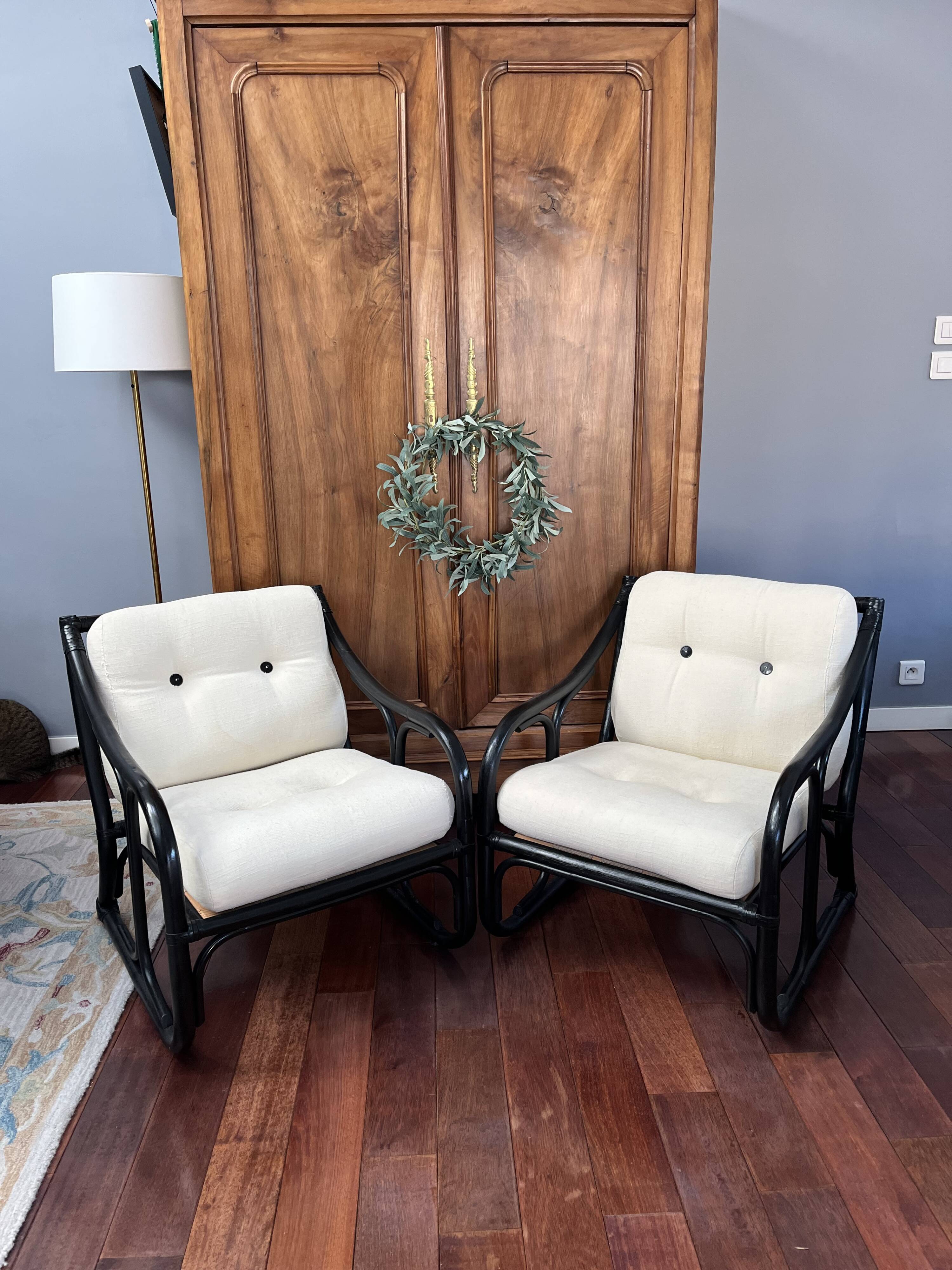 Set of two vintage black and white bamboo chairs.