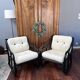 Set of two vintage black and white bamboo chairs.
