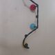 Vintage wall coat rack "Atomic" in wrought iron with multicoloured balls.