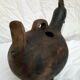 Pourer, terracotta teapot. Hen.