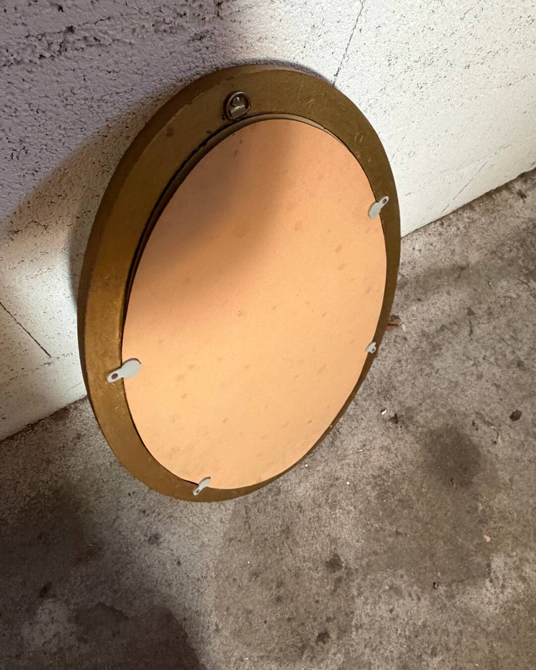 Golden oval mirror