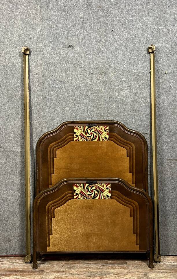 Art Nouveau period bed in painted iron faux wood with stylized colored patterns