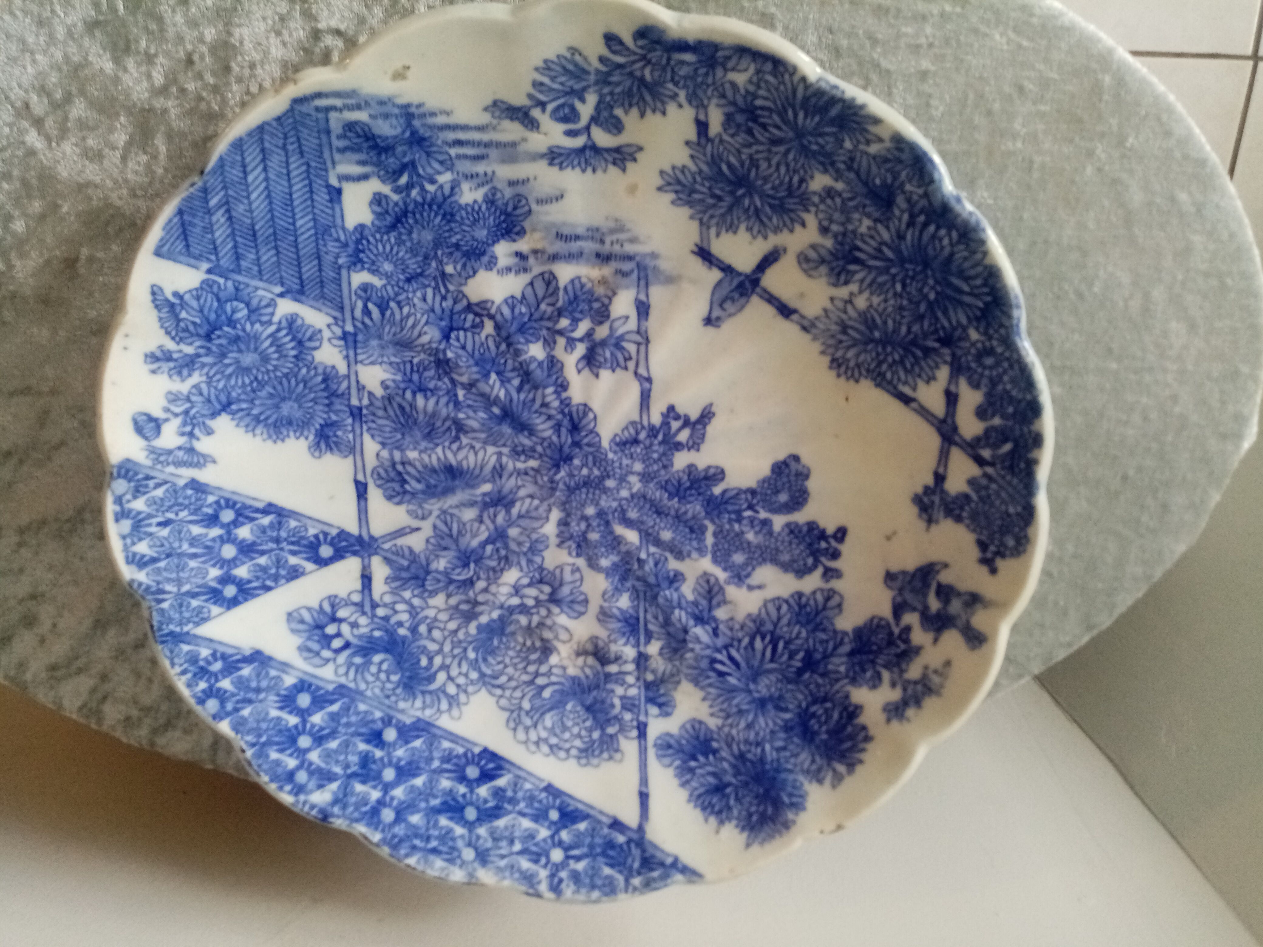 Asian earthenware dish with floral and bird decoration