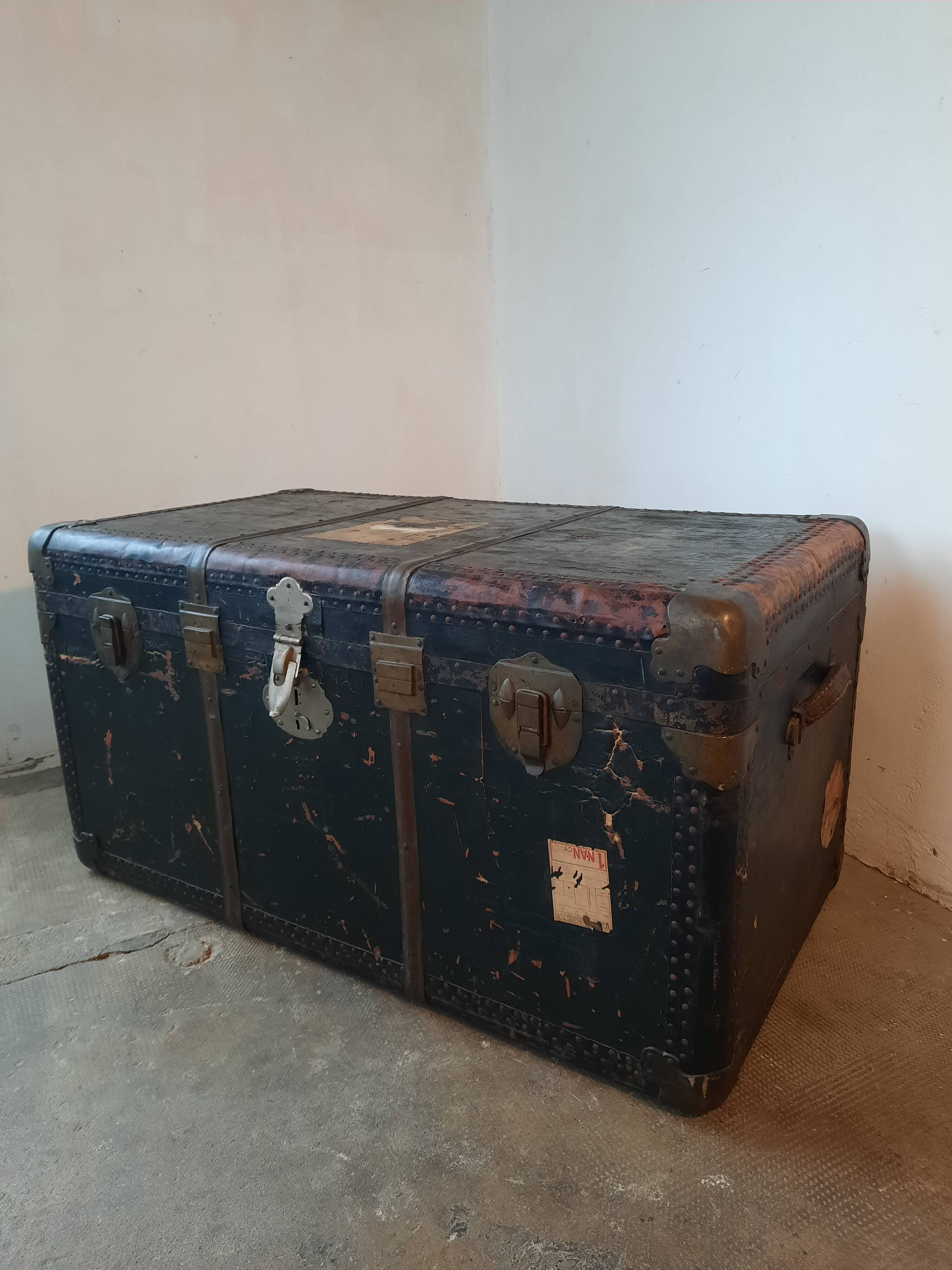 Old and large travel trunk, brass-plated corners