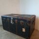 Old and large travel trunk, brass-plated corners