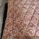 Vintage duvet/bedspread with a paisley pattern.