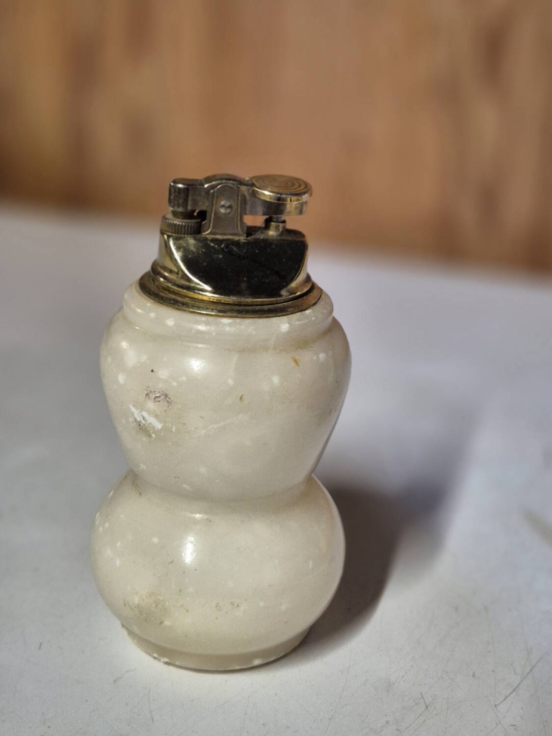 Vintage table lighter made of alabaster marble with a sculpted metal mechanism.