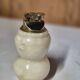 Vintage table lighter made of alabaster marble with a sculpted metal mechanism.