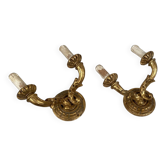 Pair of gilded wooden wall lights with two arms, early 20th century.