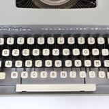 Remington travel-deter Deluxe typewriter with  case