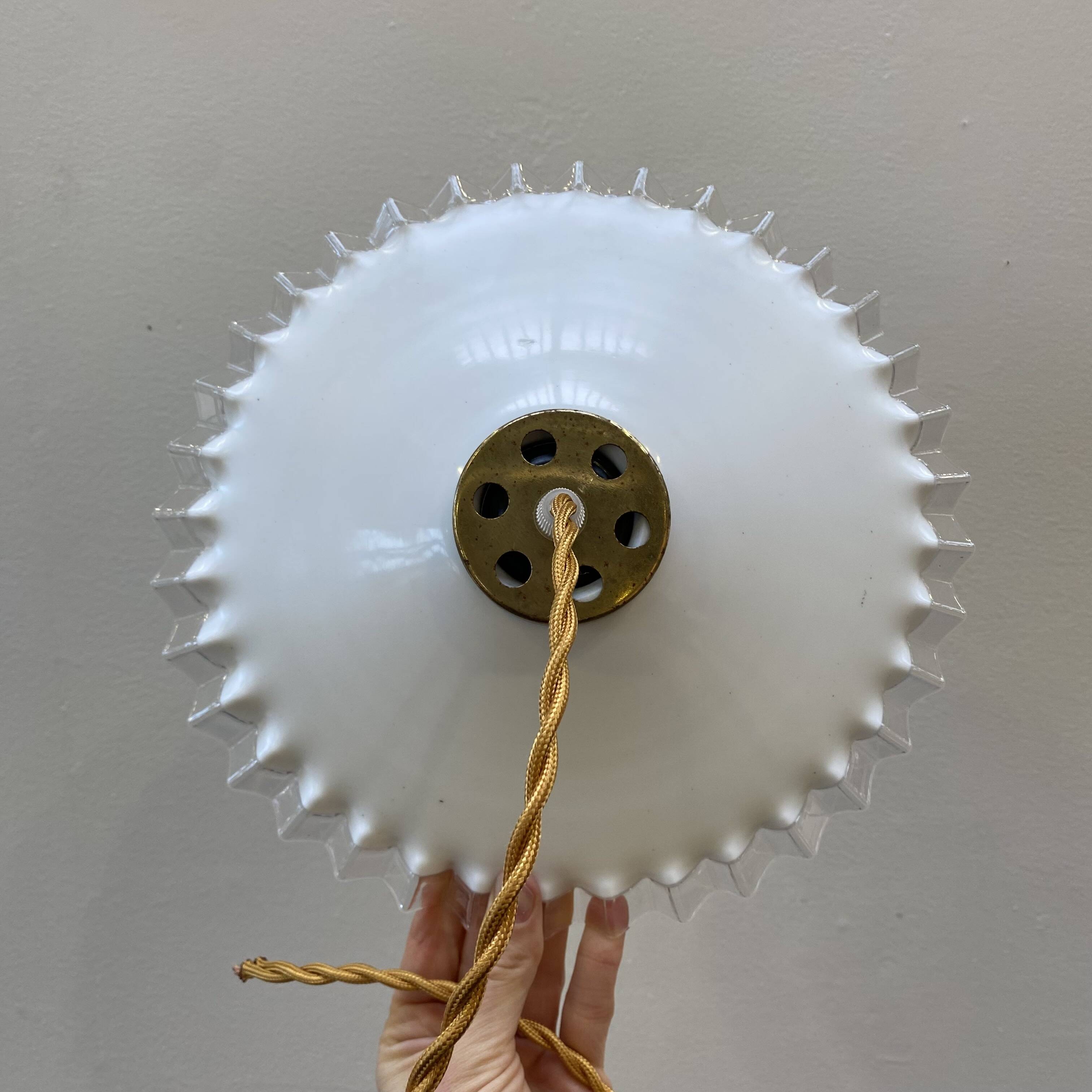 White opaline pendant light with transparent serrated edges