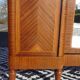Three-door wardrobe with marquetry and bronze.