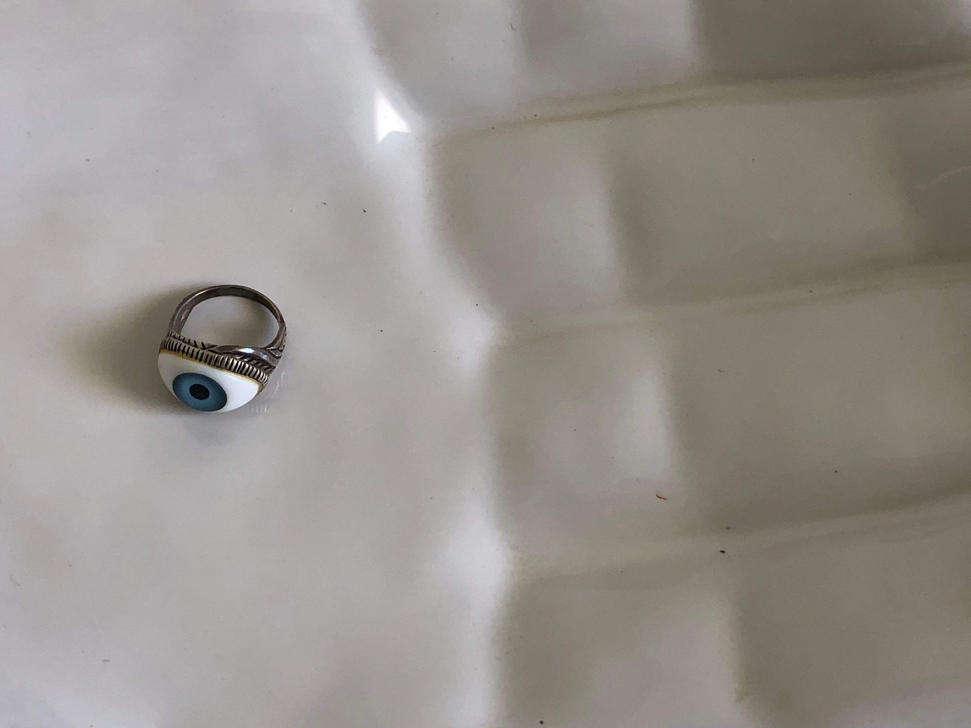 Empty white enamelled ceramic pocket in the shape of a large hand, 1990