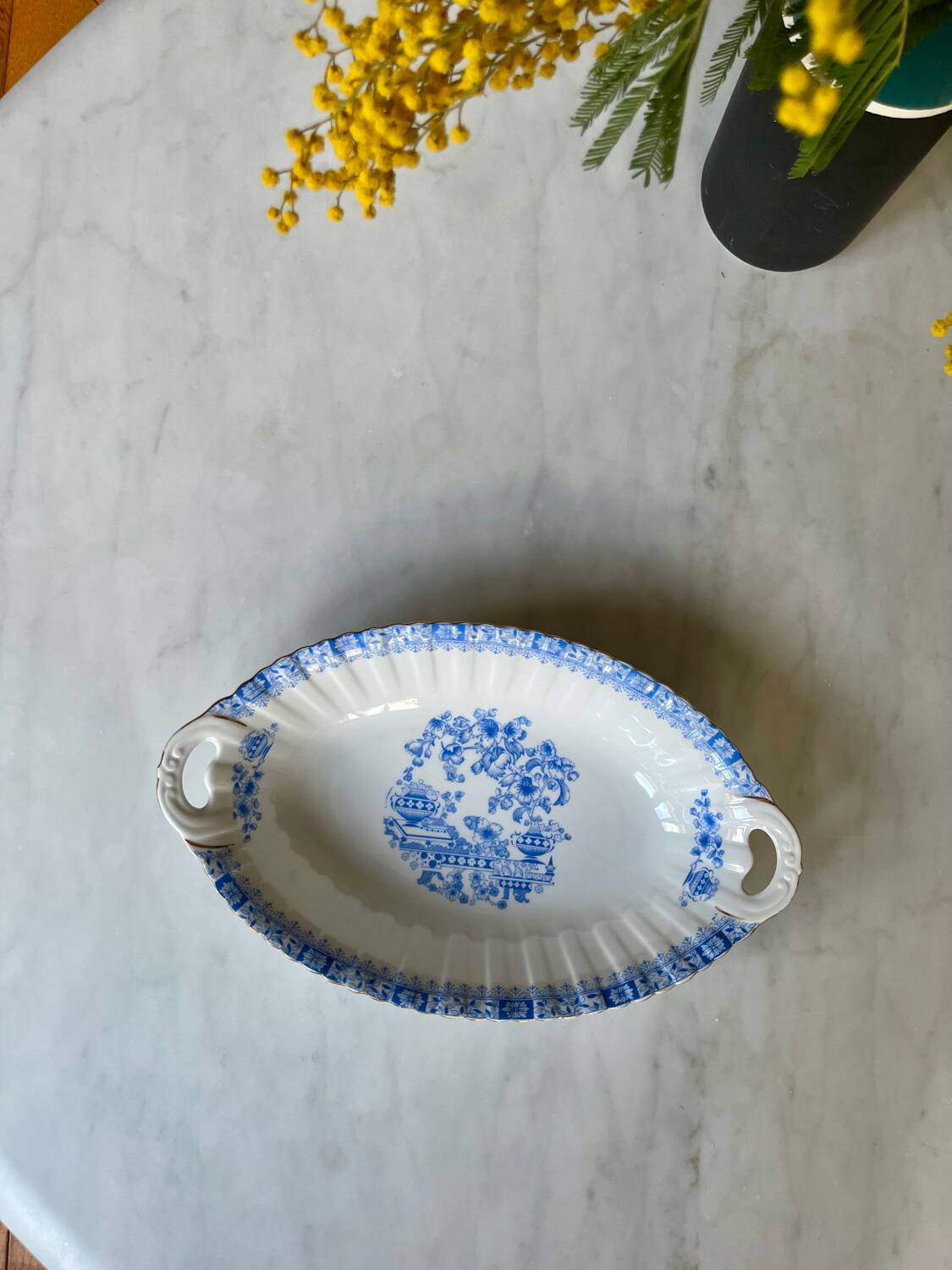 Antique oval dish with handles in earthenware