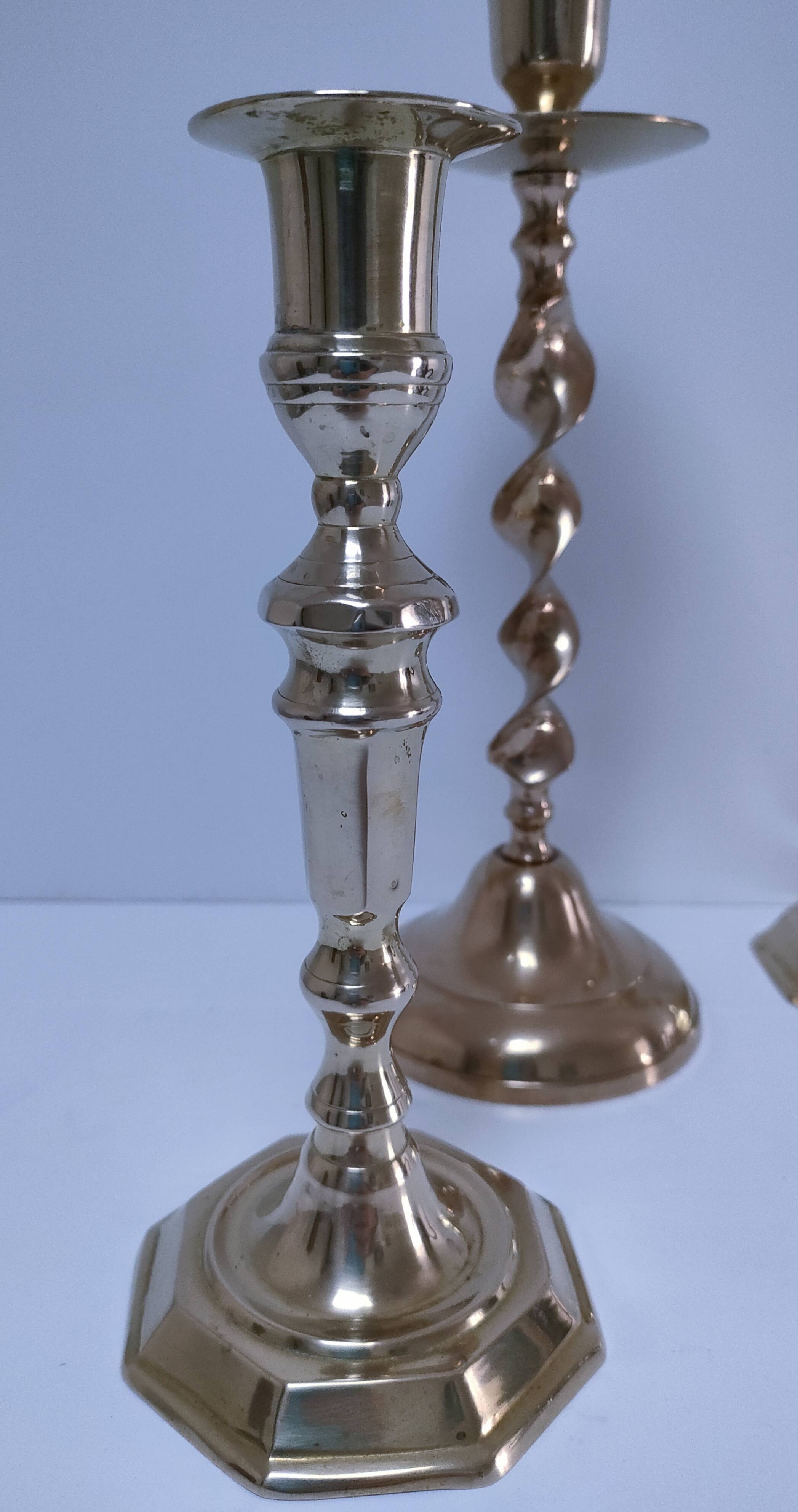 Three vintage solid brass candle holders
