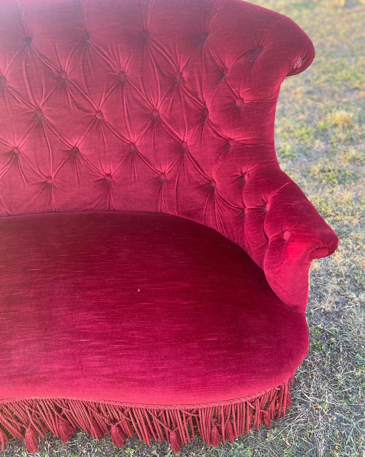 Small old Napoleon III toad sofa in red velvet
