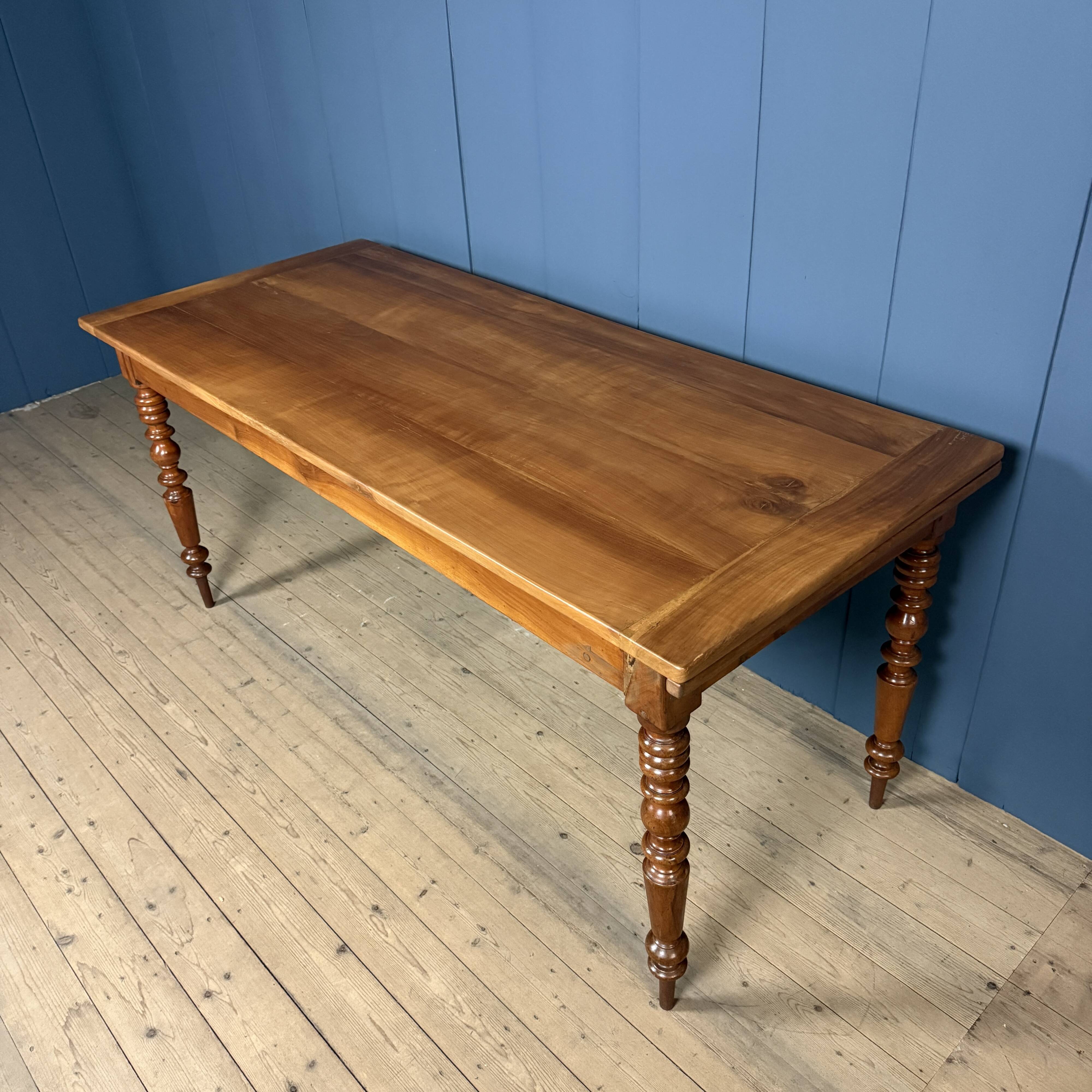 Antique cherry wood dining table from France.