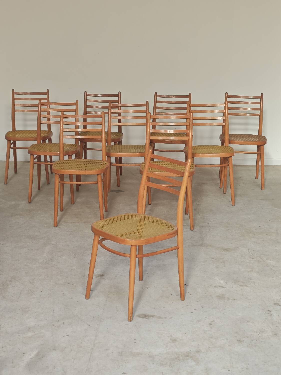 Set of 10 Bystrice tone wooden and caned chairs from the 1960s.
