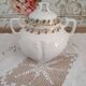 White porcelain sugar bowl decoration in relief and green and gold frieze