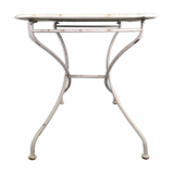 Ancienne table de jardin pliante en fer forgé blanche