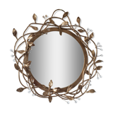 Round mirror in gilded wrought iron and leaves